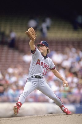 CIRCA 1990:  Mark Langston #12 of the California Angels pitches in a circa 1990s game. Langston played for the Angels from 1990-97. (Photo by Lonnie Major/Getty Images)