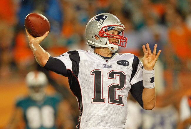 MIAMI GARDENS, FL - SEPTEMBER 12:  Tom Brady #12 of the New England Patriots passes during a game against the Miami Dolphins at Sun Life Stadium on September 12, 2011 in Miami Gardens, Florida.  (Photo by Mike Ehrmann/Getty Images)