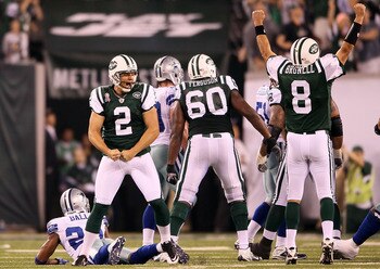 EAST RUTHERFORD, NJ - SEPTEMBER 11:  Nick Folk #2 and Mark Brunell #8 of the New York Jets celebrate after Folk kicked a successful 50-yard game-winning field goal against the Dallas Cowboys during their NFL Season Opening Game at MetLife Stadium on Septe