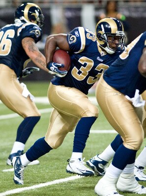ST.LOUIS, MO - AUGUST 20: Cadillac Williams #33 of the St. Louis Rams rushes for a gain during a pre-season game against the Tennessee Titans at the Edward Jones Dome on August 20, 2011 in St.Louis, Missouri.  (Photo by Ed Szczepanski/G2etty Images)