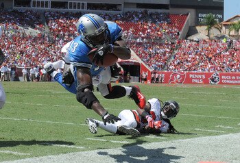 TAMPA, FL - SEPTEMBER 11:  Wide receiver Nate Burleson #13 of the Detroit Lions dives toward the endzone during the season opener against the Tampa Bay Buccaneers at Raymond James Stadium September 11, 2011 in Tampa, Florida. (Photo by Al Messerschmidt/Ge