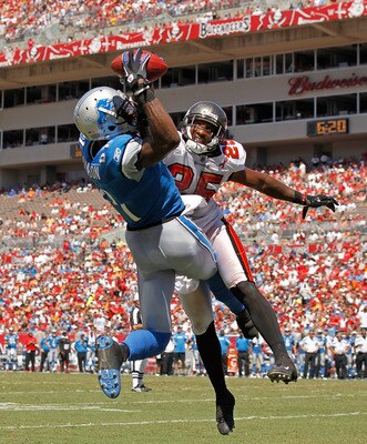 TAMPA, FL - SEPTEMBER 11:  Calvin Johnson #81 of the Detroit Lions makes a touchdown catch over  Aqib Talib #25 of the Tampa Bay Buccaneers during the season opener at Raymond James Stadium on September 11, 2011 in Tampa, Florida.  (Photo by Mike Ehrmann/