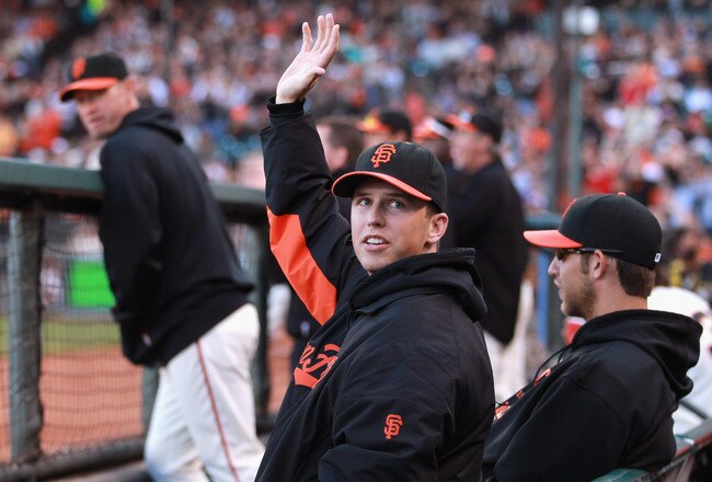 SAN FRANCISCO, CA - JULY 10:  Injured Buster Posey #28 of the San Francisco Giants waves to the crowd while sitting in the dugout during their game against the New York Mets at AT&T Park on July 10, 2011 in San Francisco, California.  (Photo by Ezra Shaw/