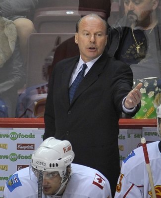 VANCOUVER, CANADA - APRIL 7: Calgary Flames Head Coach Mike Keenan instructs a player during their game against the Vancouver Canucks at General Motors Place April 7, 2009 in Vancouver, Canada.   (Photo by Nick Didlick/Getty Images)