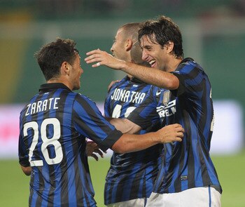PALERMO, ITALY - SEPTEMBER 11:  Diego Milito (R) of Inter celebrates with Mauro Zarate after scoring the opening goal during the Serie A match between US Citta di Palermo and FC Internazionale Milano at Stadio Renzo Barbera on September 11, 2011 in Palerm