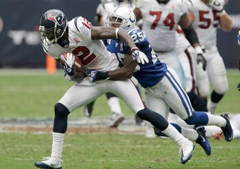 HOUSTON, TX - SEPTEMBER 11:  Wide receiver Jacoby Jones #12 of the Houston Texans is tackled by defensive back Jerraud Powers #25 of the Indianapolis Colts on September 11, 2011 at Reliant Stadium in Houston, Texas. Texans won 34 to 7.(Photo by Thomas B.