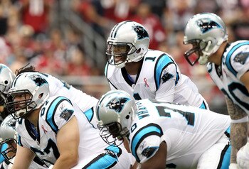 GLENDALE, AZ - SEPTEMBER 11:  Quarterback Cam Newton #1 of the Carolina Panthers prepares to snap the football against the Arizona Cardinals during the NFL season opening game at the University of Phoenix Stadium on September 11, 2011 in Glendale, Arizona
