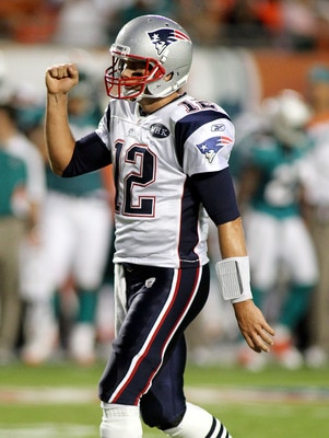 MIAMI GARDENS, FL - SEPTEMBER 12:  Quarterback Tom Brady #12 of the New England Patriots celebrates a touchdown against the Miami Dolphins at Sun Life Stadium on September 12, 2011 in Miami Gardens, Florida.  (Photo by Marc Serota/Getty Images)
