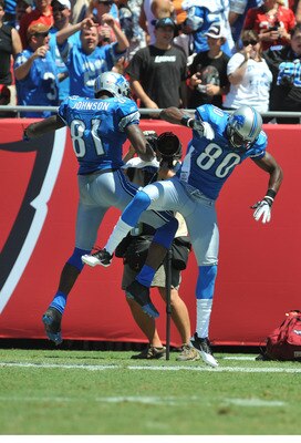 TAMPA, FL - SEPTEMBER 11:  Wide receivers Calvin Johnson #81 and Maurice Stovall #80 of the Detroit Lions celebrate after a touchdown against the Tampa Bay Buccaneers during the season opener at Raymond James Stadium September 11, 2011 in Tampa, Florida.