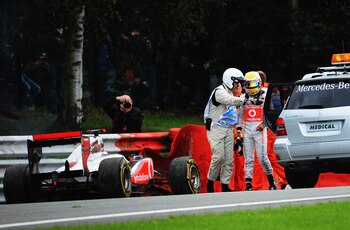 SPA FRANCORCHAMPS, BELGIUM - AUGUST 28:  Lewis Hamilton of Great Britain and McLaren is helped into the medical car after crashing out during the Belgian Formula One Grand Prix at the Circuit of Spa Francorchamps on August 28, 2011 in Spa Francorchamps, B