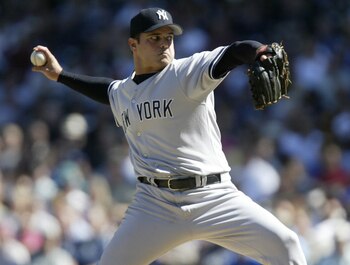 SEATTLE - SEPTEMBER 1:  Starting pitcher Jaret Wright #33 of the New York Yankees pitches against the Seattle Mariners on September 1, 2005 at Safeco Field in Seattle, Washington. Wright was removed from the game in the sixth innig after being hit by a ba