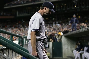 DETROIT - OCTOBER 06:  Starting pitcher Randy Johnson #41 of the New York Yankees hangs his head as he walks down the down steps after being replaced by relief pitcher Brian Bruney in the bottom of the sixth inning against the Detroit Tigers during Game T