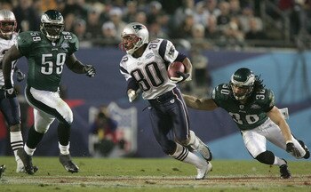 JACKSONVILLE, FL - FEBRUARY 6:  Wide receiver Troy Brown #80 of the New England Patriots carries the ball past J.R. Reed #30 and Mike Labinjo #59 of the Philadelphia Eagles during Super Bowl XXXIX at Alltel Stadium on February 6, 2005 in Jacksonville, Flo