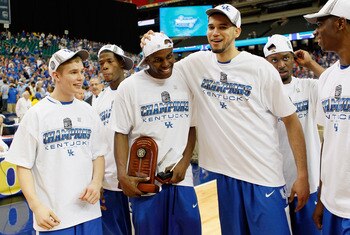 ATLANTA, GA - MARCH 13:  Jarrod Polson #5, MVP Darius Miller #1 and Elroy Vargas #30 of the Kentucky Wildcats celebrate their 70 to 54 win over the Florida Gators in the championship game of the SEC Men's Basketball Tournament at Georgia Dome on March 13,