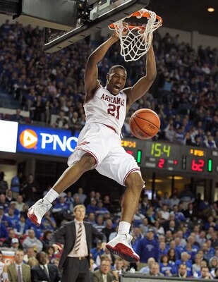 LOUISVILLE, KY - DECEMBER 08: Delvon Johnson #21 of the Arkansas Razorbacks dunks the ball during the game against the Seton Hall Pirates in the 2010 DIRECTV SEC/BIG EAST Invitational at Freedom Hall on December 8, 2010 in Louisville, Kentucky.  (Photo by
