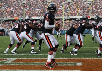 CHICAGO, IL - SEPTEMBER 11: Jay Cutler #6 of the Chicago Bears looks for a receiver as teammates (L-R) J'Marcus Webb #73, Chris Williams #74, Roberto Garza #63 and Chris Spencer #67 block against the Atlanta Falcons at Soldier Field on September 11, 2011