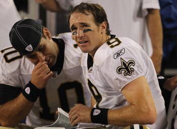 GREEN BAY, WI - SEPTEMBER 08:  Drew Brees #9 of the New Orleans Saints sits on the bench with Chase Daniel #10 during the NFL opening season game against the Green Bay Packers at Lambeau Field on September 8, 2011 in Green Bay, Wisconsin. The Packers defe