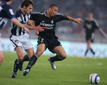 SAN SEBASTIAN, SPAIN - APRIL 30:  Real's Ronaldo #9 (R) fends off Sociedad's Jose Javier Barkero during a La Liga match between Real Sociedad and Real Madrid at the Anoeta stadium on April 30, 2005 in San Sebastian, Spain. Madrid won 2-0.  (Photo by Denis