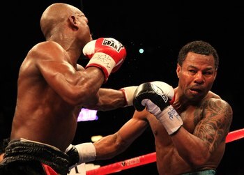 LAS VEGAS - MAY 01:  (L-R) Floyd Mayweather Jr. in action against Shane Mosley during their welterweight fight at the MGM Grand Garden Arena on May 1, 2010 in Las Vegas, Nevada. Mayweather Jr. defeated Mosley by unanimous decison.  (Photo by Jed Jacobsohn
