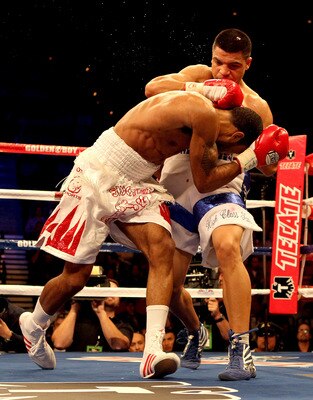 LAS VEGAS - DECEMBER 11:  (R-L) Victor Ortiz throws a right to the head of Lamont Petersen during the super lightweight fight at Mandalay Bay Events Center on December 11, 2010 in Las Vegas, Nevada.  (Photo by Scott Heavey/Getty Images)