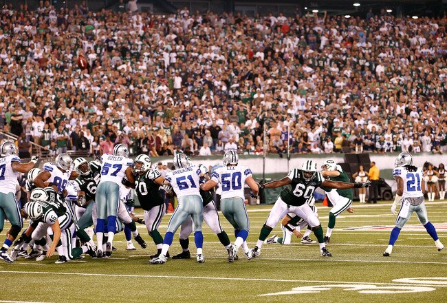 EAST RUTHERFORD, NJ - SEPTEMBER 11:  Nick Folk #2 of the New York Jets kicks a successful 50-yard game-winning field goal against the Dallas Cowboys during their NFL Season Opening Game at MetLife Stadium on September 11, 2011 in East Rutherford, New Jers