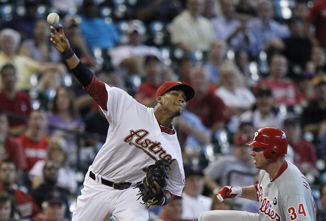 HOUSTON - SEPTEMBER 14:  Third baseman Jimmy Paredes #38 of the Houston Astros throws to first base after a force out of Roy Halladay #34 of the Philadelphia Phillies at Minute Maid Park on September 14, 2011 in Houston, Texas.  (Photo by Bob Levey/Getty