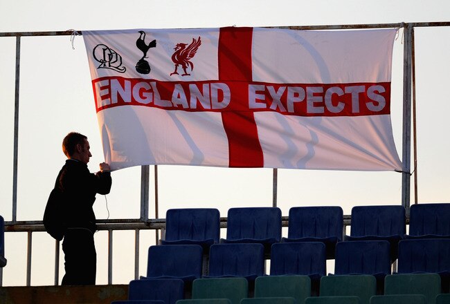 SOFIA, BULGARIA - SEPTEMBER 02: An England fan puts up a flag ahead of the EURO 2012 Qualifier match between Bulgaria and England at the Vasil Levski National Stadium on September 2, 2011 in Sofia, Bulgaria.  (Photo by Michael Regan/Getty Images)