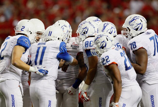 ATLANTA, GA - SEPTEMBER 03:  Kellen Moore #11 of the Boise State Broncos huddles with his offense against the Georgia Bulldogs at Georgia Dome on September 3, 2011 in Atlanta, Georgia.  (Photo by Kevin C. Cox/Getty Images)