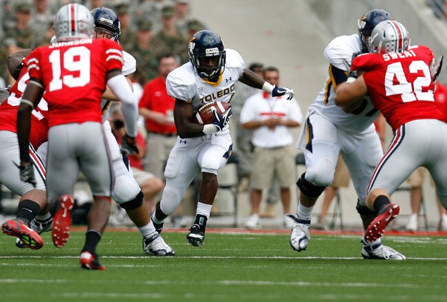 COLUMBUS, OH - SEPTEMBER 10:  Adonis Thomas #24 of the Toledo Rockets runs the ball up field against the Ohio State Buckeyes during the first half on September 10, 2011 at Ohio Stadium in Columbus, Ohio. Ohio State defeated Toledo 27-22. (Photo by Kirk Ir