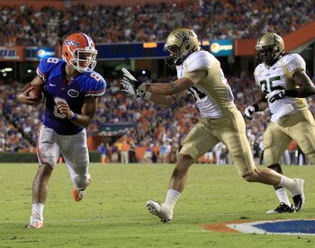GAINESVILLE, FL - SEPTEMBER 10: Trey Burton #8 of the Florida Gators scores a touchdown past D.A. Autry #21 of the UAB Blazers during a game at Ben Hill Griffin Stadium on September 10, 2011 in Gainesville, Florida.  (Photo by Sam Greenwood/Getty Images)