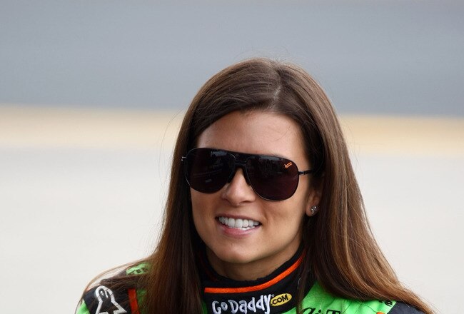LOUDON, NH - AUGUST 14:   Danica Patrick, driver of the #7 Team GoDaddy Andretti Autosport, looks on from the pits during warmup for the Dallara Honda, during the IZOD IndyCar Series MoveThatBlock.com Indy 225 at New Hampshire Motor Speedway on August 14,