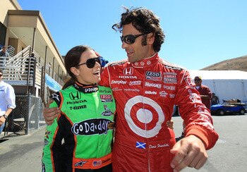 SONOMA, CA - AUGUST 26:  Dario Franchitti of Scotland, driver of the Target Chip Ganassi Racing Dallara Honda, talks with Danica Patrick, driver of the #7 GoDaddy Andretti Autosport Dallara Honda, during practice for the IZOD IndyCar Series Grand Prix at