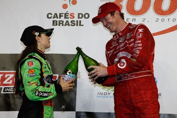 HOMESTEAD, FL - OCTOBER 02:  Danica Patrick, driver of the #7 Team GoDaddy.com Dallara Honda celebrates her second place finish with winner Scott Dixon of New Zealand, driver of the #9 Target Chip Ganassi Racing Dallara Honda during the Cafes do Brasil In