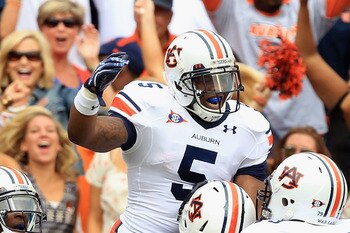 CLEMSON, SC - SEPTEMBER 17:  Michael Dyer #5 of the Auburn Tigers celebrates with teammates after scoring a touchdown against the Clemson Tigers during their game at Memorial Stadium on September 17, 2011 in Clemson, South Carolina.  (Photo by Streeter Le