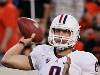 STILLWATER, OK - SEPTEMBER 8:  Quarterback Nick Foles #8 of the Arizona Wildcats looks to throw during the first half against the Oklahoma State Cowboys on September 8, 2011 at Boone Pickens Stadium in Stillwater, Oklahoma.  Oklahoma State defeated Arizon