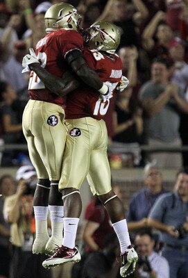 TALLAHASSEE, FL - SEPTEMBER 17:  (L-R) Telvin Smith #22 and Nigel Bradham #13 of the Florida State Seminoles celebrate an interception against the Oklahoma Sooners at Doak Campbell Stadium on September 17, 2011 in Tallahassee, Florida.  (Photo by Ronald M