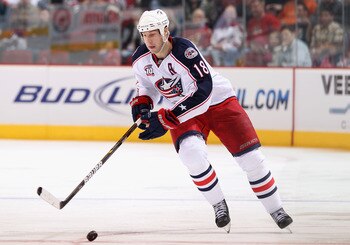 GLENDALE, AZ - MARCH 24:  R.J. Umberger #18 of the Columbus Blue Jackets skates with the puck during the NHL game against the Phoenix Coyotes at Jobing.com Arena on March 24, 2011 in Glendale, Arizona.  The Coyotes defeated the Blue Jackets 3-0.  (Photo b