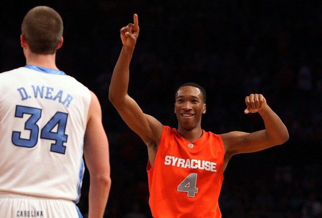 NEW YORK - NOVEMBER 20:  Wes Johnson #4 of the Syracuse Orange celebrates after defeating the North Carolina Tar Heels in the championship game of the 2K Sports Classic on November 20, 2009 at Madison Square Garden in New York City. The Orange defeated th