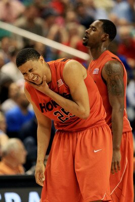 GREENSBORO, NC - MARCH 12:  Manny Atkins #25 of the Virginia Tech Hokies reacts holding his face during the second half against the Duke Blue Devils in the semifinals of the 2011 ACC men's basketball tournament at the Greensboro Coliseum on March 12, 2011