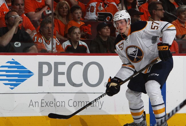 PHILADELPHIA, PA - APRIL 26:  Tyler Myers #57 of the Buffalo Sabres controls the puck against the Philadelphia Flyers in Game Seven of the Eastern Conference Quarterfinals during the 2011 NHL Stanley Cup Playoffs at Wells Fargo Center on April 26, 2011 in
