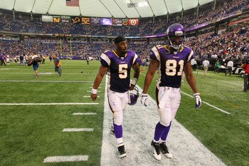 MINNEAPOLIS, MN - SEPTEMBER 18:  Donovan McNabb #5 and Visanthe Shiancoe #81 of the Minnesota Vikings walk off the field after loosing 24-24  to the Tampa Bay Buccaneers at the Hubert H. Humphrey Metrodome on September 18, 2011 in Minneapolis, Minnesota.