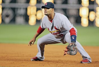 PHILADELPHIA , PA - SEPTEMBER 18:  Albert Pujols #5 of the St Louis Cardinals fields first base against the Philadelphia Phillies at Citizens Bank Park on September 18, 2011 in Philadelphia, Pennsylvania. The Cardinals defeated the Phillies 5-0. (Photo by