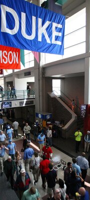 GREENSBORO, NC - MARCH 13:  Fans walk through the corridor of the Greensboro Coliseum before the Duke Blue Devils take on the North Carolina Tar Heels in the championship game of the 2011 ACC men's basketball tournament at the Greensboro Coliseum on March