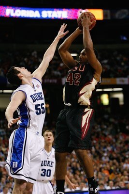 ATLANTA - MARCH 15:  Ryan Reid #42 of the Florida State Seminoles shoots against Brian Zoubek #55 of the Duke Blue Devils during the championship game of the 2009 ACC Men's Basketball Tournament on March 15, 2009 at the Georgia Dome in Atlanta, Georgia.