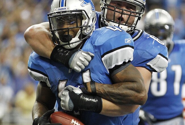 DETROIT, MI - SEPTEMBER 18:  Jahvid Best #44 of the Detroit Lions scores on a 1 yard touchdown run in the fourth quarter and celebrates with teammate Stephen Peterman #69 during the game against the Kansas City Chiefs at Ford Field on September 18, 2011 i