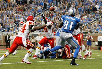 DETROIT, MI - SEPTEMBER 18: Calvin Johnson #81 of the Detroit Lions scores on a 1 yard pass in the third quarter from Matthew Stafford #9 as Brandon Lewis #24 of the Kansas CIty Chiefs defends during the game at Ford Field on September 18, 2011 in Detroit