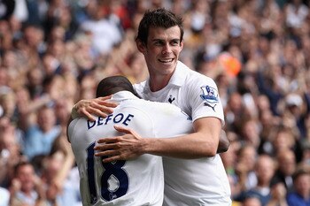 LONDON, ENGLAND - SEPTEMBER 18:  Jermain Defoe of Tottenham Hotspur celebrates scoring his side's second goal with team mate Gareth Bale during the Barclays Premier League match between Tottenham Hotspur and Liverpool at White Hart Lane on September 18, 2