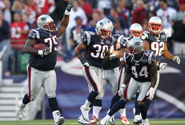 FOXBORO, MA -  SEPTEMBER 18:  Vince Wilfork #75 of the New England Patriots celebrates his interception and run with teammates against the San Diego Chargers in the first half at Gillette Stadium on September 18, 2011 in Foxboro, Massachusetts. (Photo by