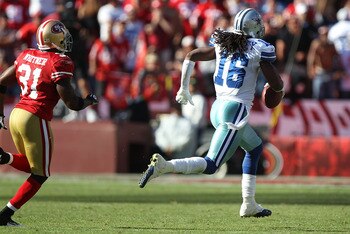 SAN FRANCISCO, CA - SEPTEMBER 18:  Jesse Holley #16 of the Dallas Cowboys runs after a catch in overtime past Donte Whitner #31 of the San Francisco 49ers at Candlestick Park on September 18, 2011 in San Francisco, California.  (Photo by Jed Jacobsohn/Get