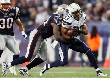 FOXBORO, MA - SEPTEMBER 18:   Vincent Jackson #83 of the San Diego Chargers is tackled by Jerod Mayo #51 of the New England Patriots on September 18, 2011 at Gillette Stadium in Foxboro, Massachusetts.  (Photo by Elsa/Getty Images)